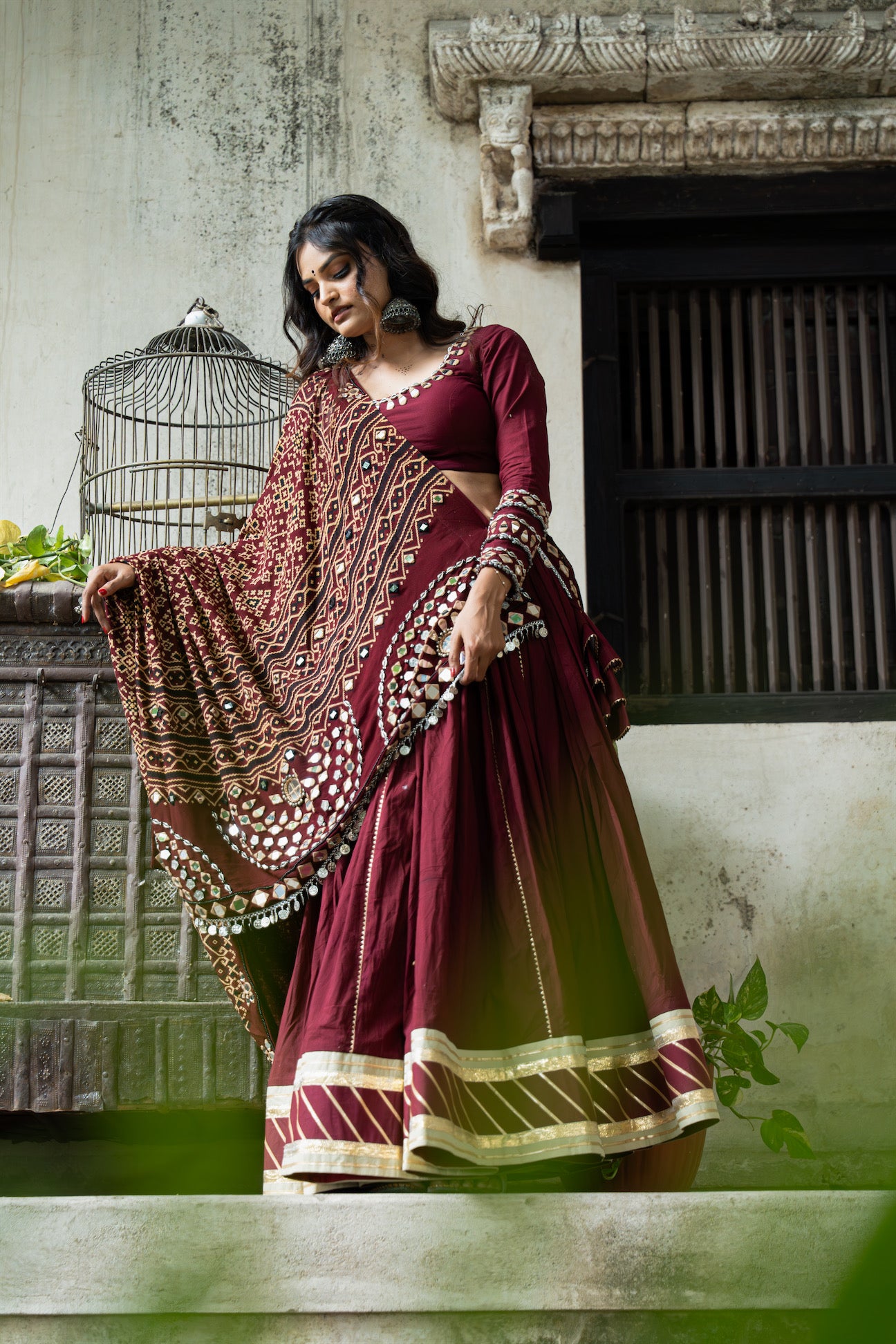 Maroon Mul Cotton Navratri Lehenga Set with Handcrafted Patola Dupatta and Mirror Work Blouse|RAAS